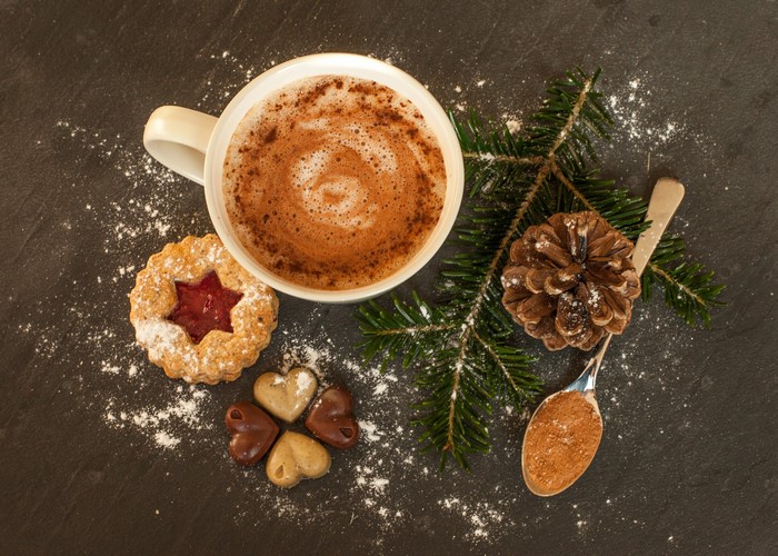 Christmas coffee with cookies and pine cone