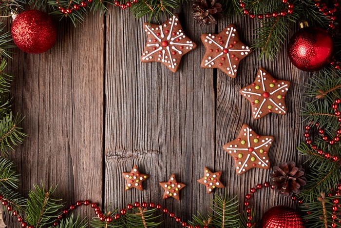 Christmas cookies and ornaments on wood