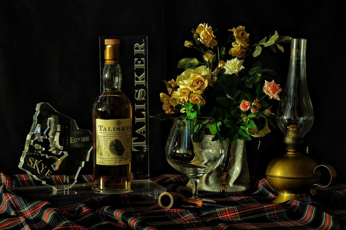 Talisker Skye Scotch bottle with roses and lamp