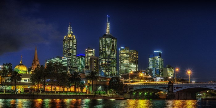 Melbourne skyline at night with Yarra River and bridge