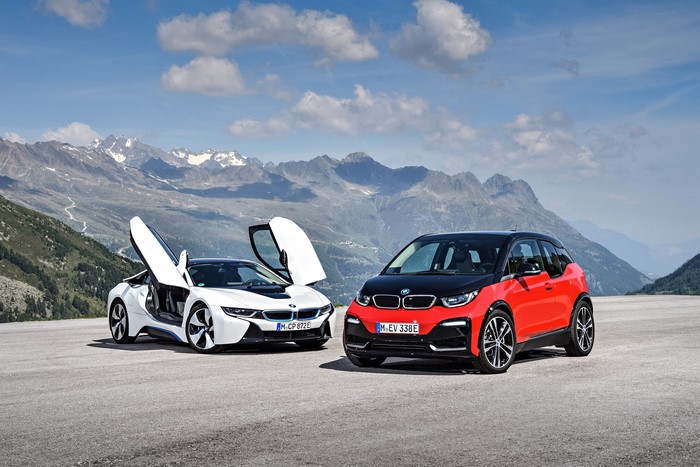 Two BMW cars in mountains