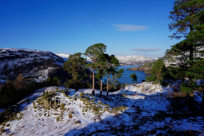 Winter landscape with snow-covered hills and a lake in Patterdale, England