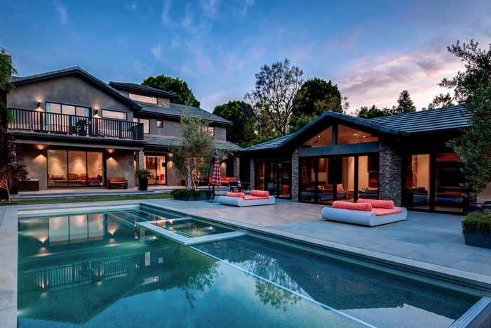 Modern house with swimming pool and lounge area