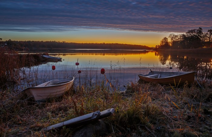 Boats on a lake at sunset in Sweden