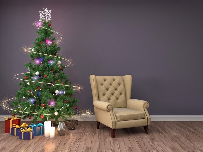 Christmas tree with gifts and armchair