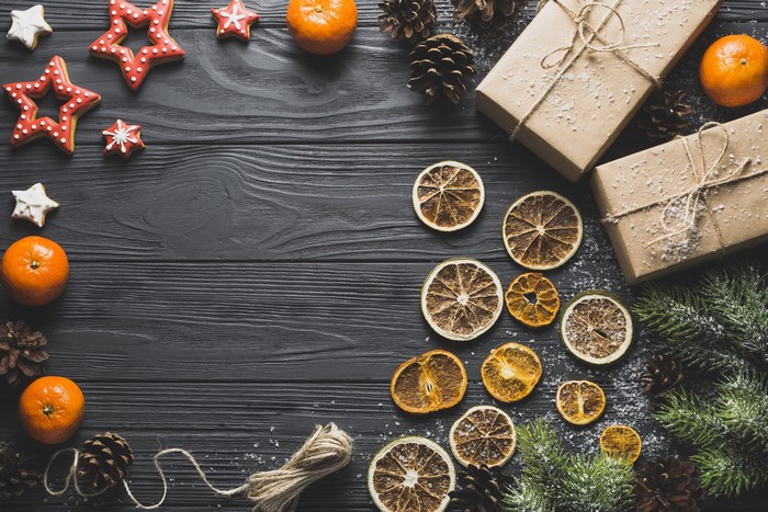 Christmas flat lay with oranges, star cookies, and gifts