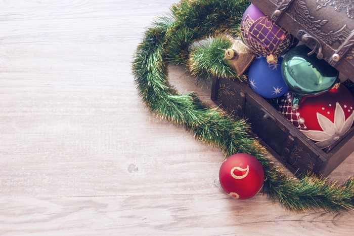 Christmas ornaments in a treasure chest with garland