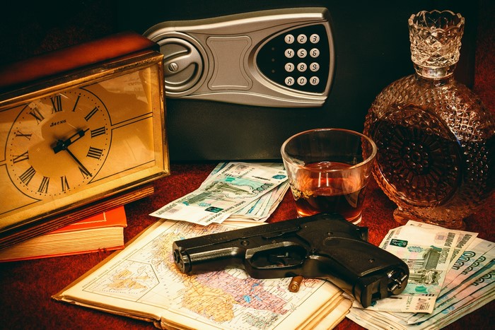 Still life with clock, pistol, money, and whiskey