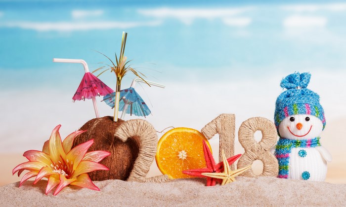 2018 New Year beach celebration with snowman and coconut cocktail