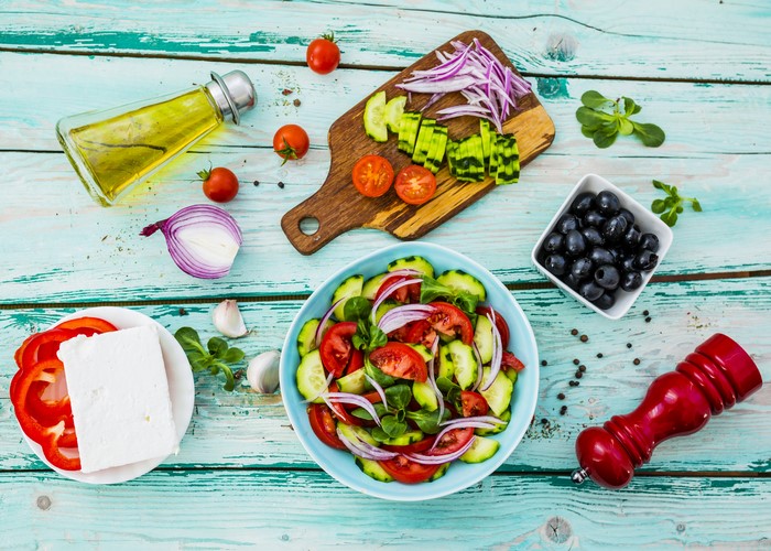 Greek Salad Ingredients on a Wooden Table