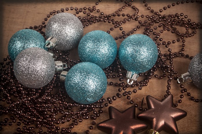 Christmas balls and beads on wood