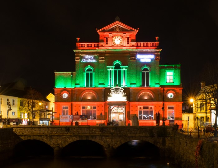 Newry Town Hall decorated with Christmas lights at night