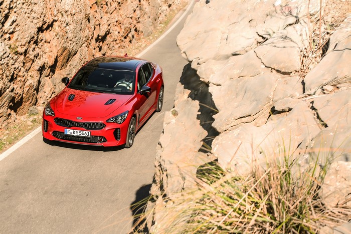 Red Kia Stinger GT on a Mountain Road