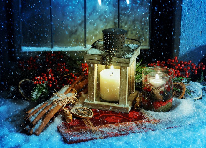 Christmas lantern with candles and cinnamon sticks