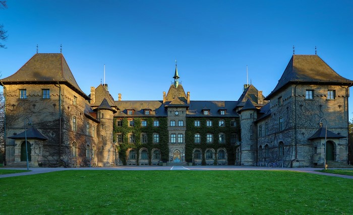 Alnarp Castle in Sweden with a green lawn