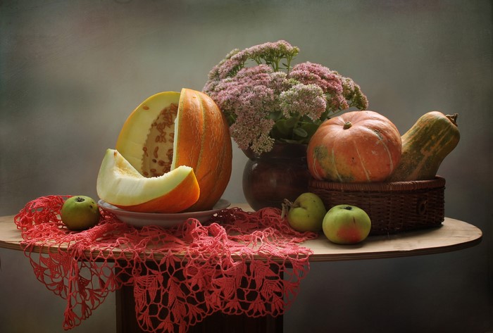 Still-life with pumpkins, melon, apples, and flowers
