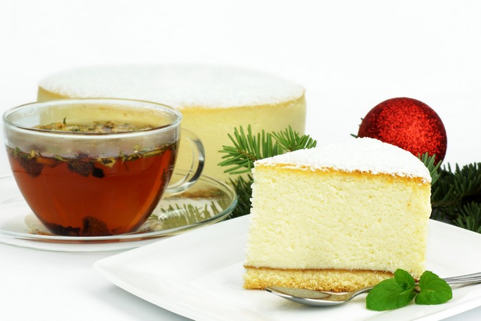 Cheesecake with tea and Christmas decorations