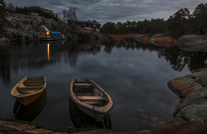 Boats on a lake at dusk in Stockholm, Sweden