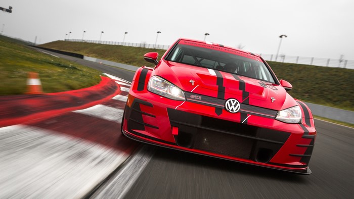 Red Volkswagen Golf GTI TCR race car on track