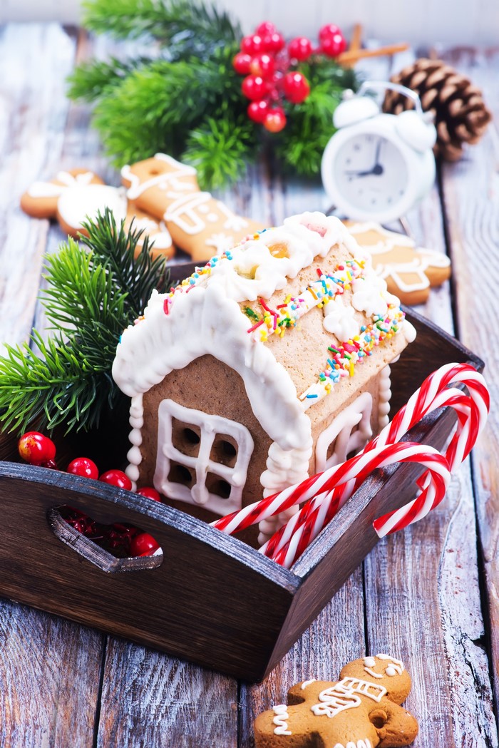 Christmas gingerbread house with candy canes and cookies