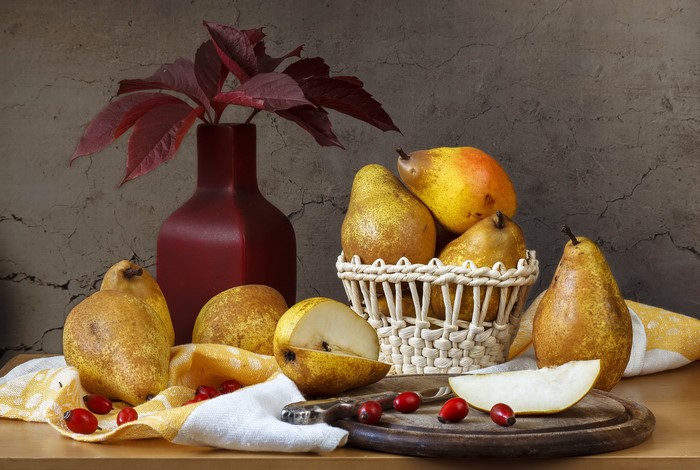 Still-life with pears, vase, and foliage