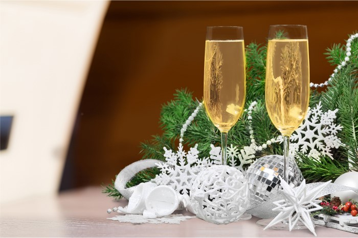 Champagne glasses with Christmas decorations