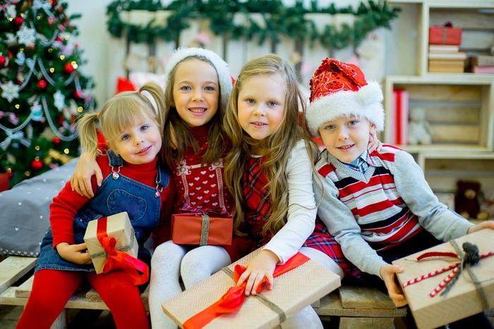 Four Children with Christmas Gifts