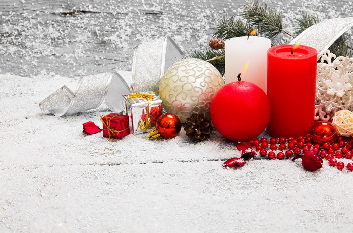Christmas decorations with candles and snow