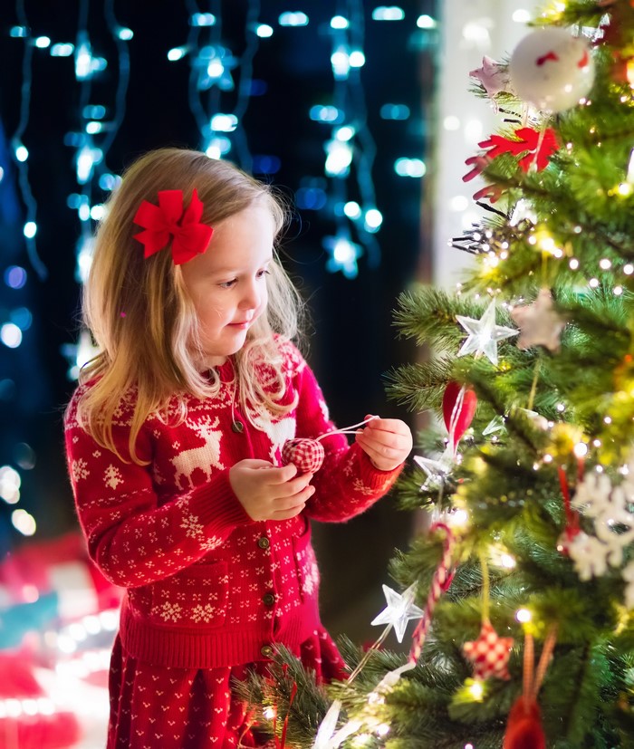 Girl Decorating Christmas Tree