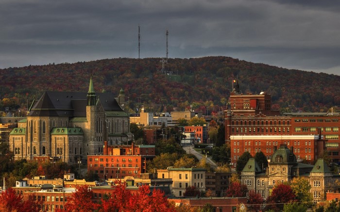 Sherbrooke cityscape with autumn foliage and a mountain in the background