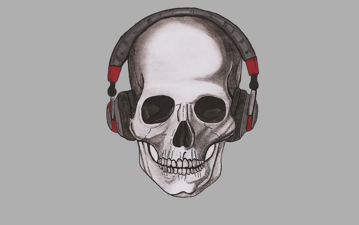 Skull wearing headphones on gray background