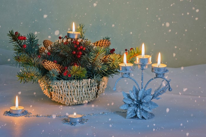Christmas centerpiece with candles and pine cones