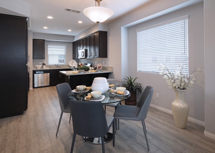 Kitchen and Dining Area with Table and Chairs
