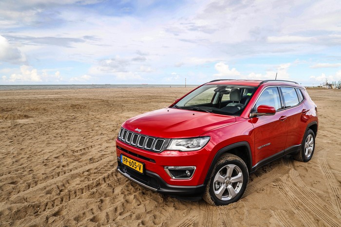 Red Jeep Compass Limited on a Sandy Beach