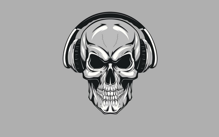 Skull with headphones on gray background