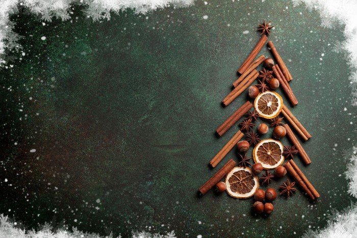 Christmas tree made of cinnamon sticks, star anise, hazelnuts, and dried oranges