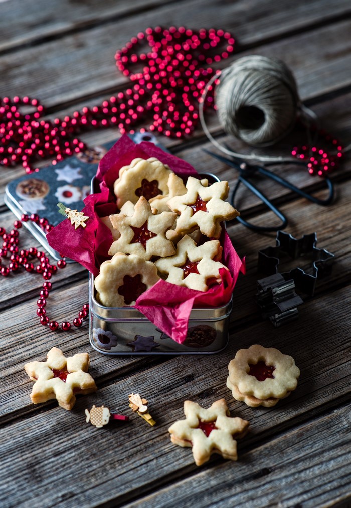 Christmas cookies in a tin with red beads