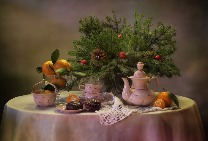 Christmas still life with tangerines and tea set
