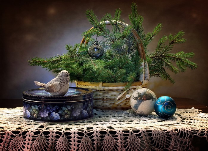 Christmas still-life with bird figurine and ornaments