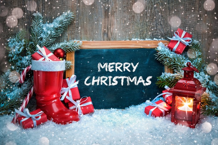 Merry Christmas chalkboard with gifts and lantern