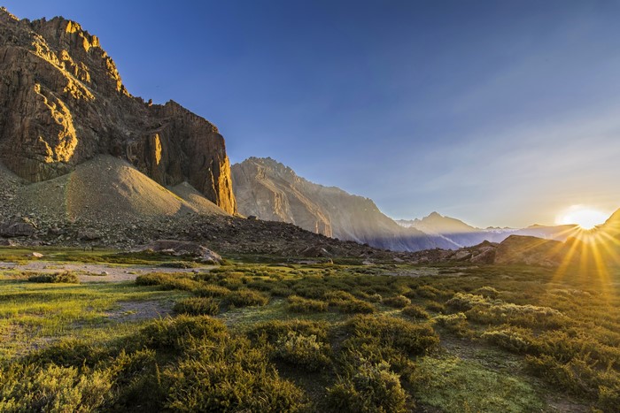 Sunrise over Andes Mountains in Chile with Grass