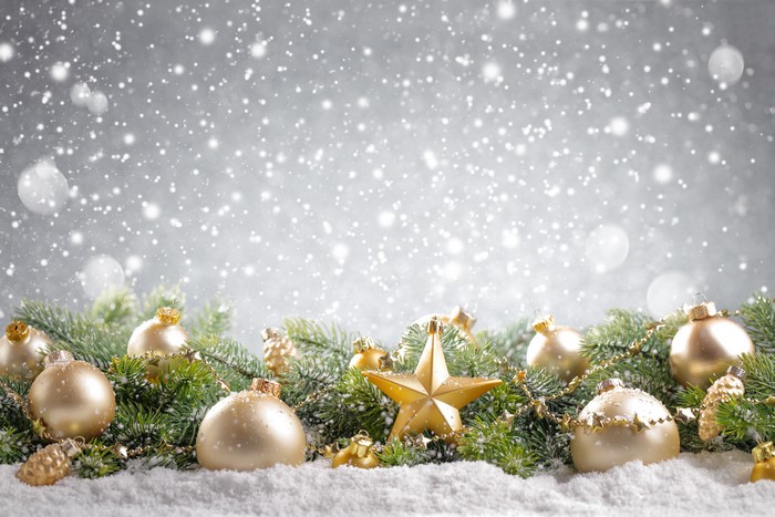 Christmas ornaments and fir branches in snow