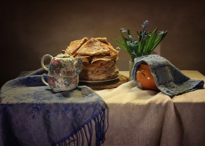 Still-life with pancakes, teapot, and flowers