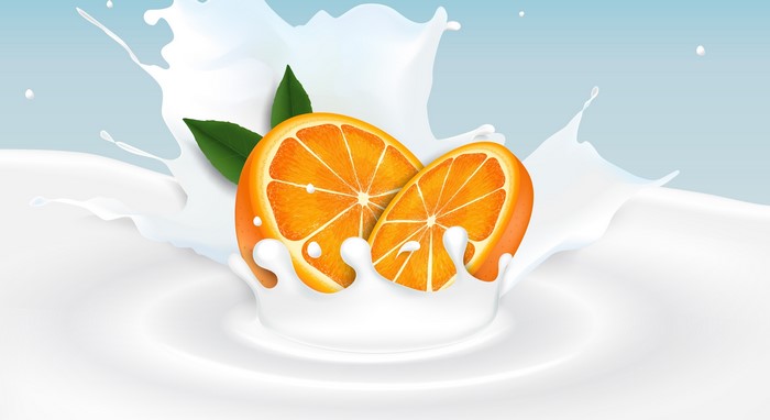 Orange Slices Splashing in Milk