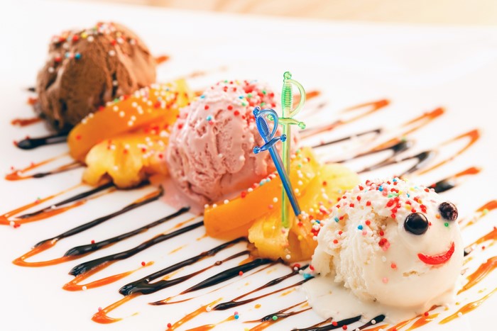 Ice cream dessert with fruit and sprinkles