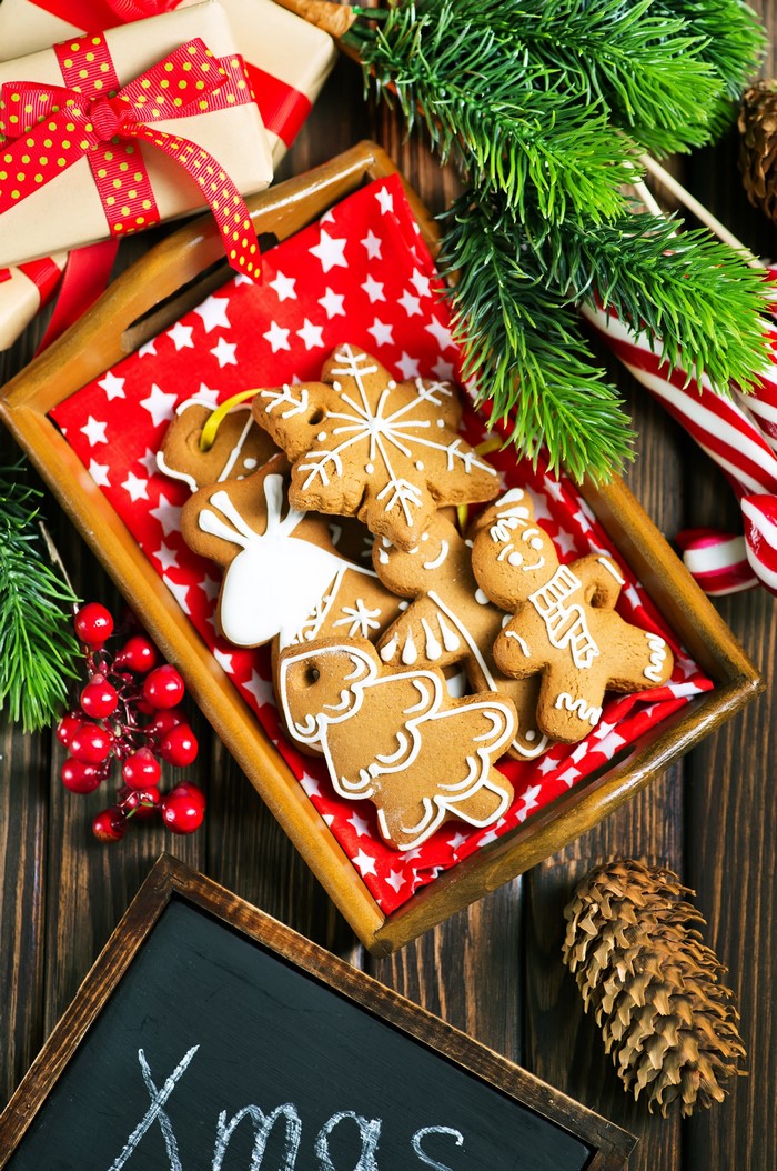 Christmas gingerbread cookies with pine cones and gifts