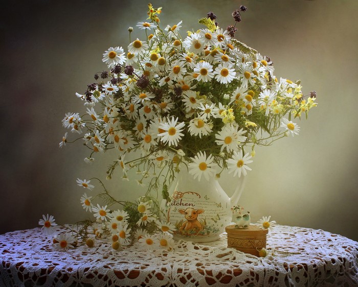 Bouquet of Camomiles in a Vase on a Table