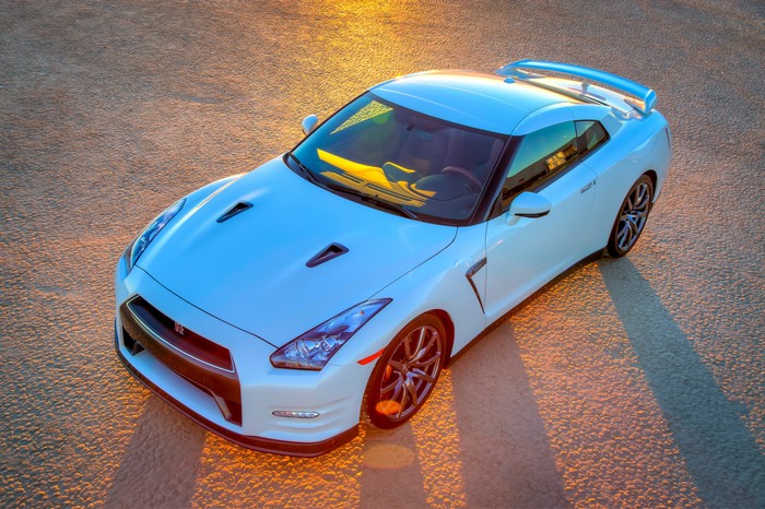White 2013 Nissan GT-R parked on textured ground