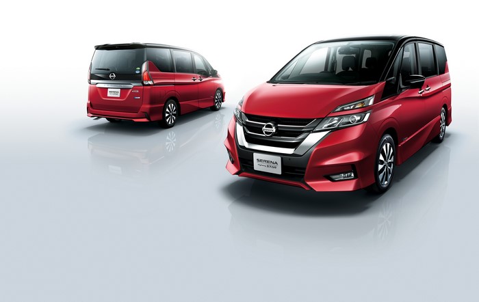 Two red Nissan Serena Highway Star minivans
