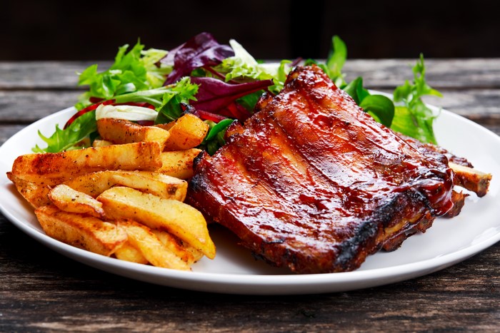 BBQ ribs with french fries and salad